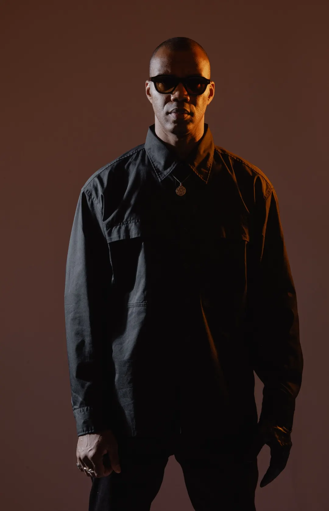 ROWZ JR in warm low light, studio portrait